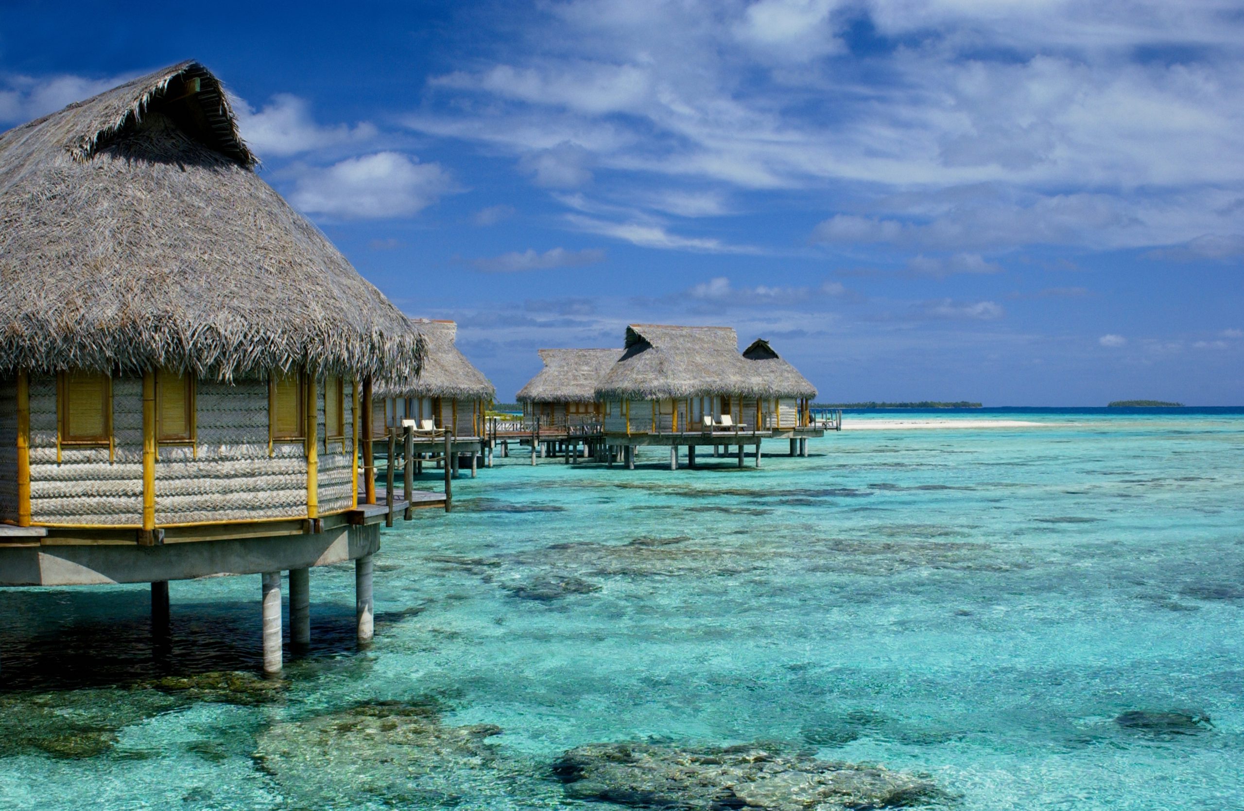 Overwater villas at a luxury vacation resort in Tahiti in French Polynesia, South Pacific.